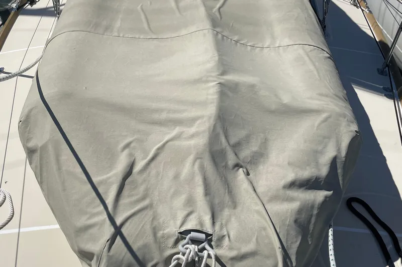 Maeve Yacht Photos Pics Covered deck of a 2004 Tartan 3700 sailboat with ropes and canvas.