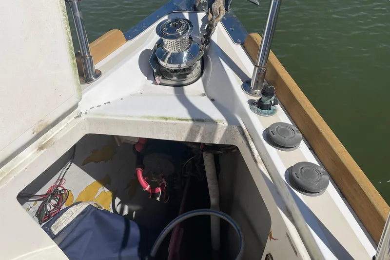 Maeve Yacht Photos Pics Bow of 2004 Tartan 3700 sailboat with anchor winch and storage compartment.