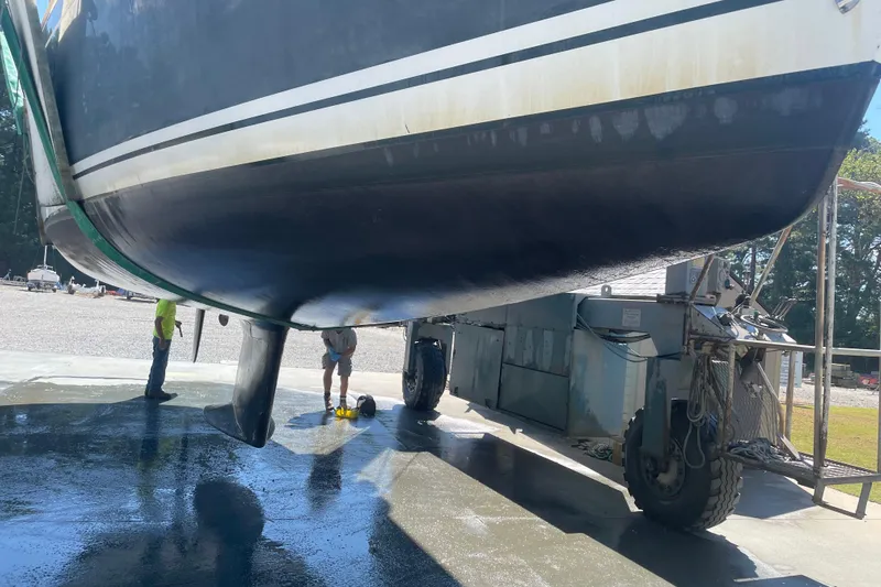 Maeve Yacht Photos Pics Tartan 3700 sailboat from 2004 being serviced on a lift at a boatyard.