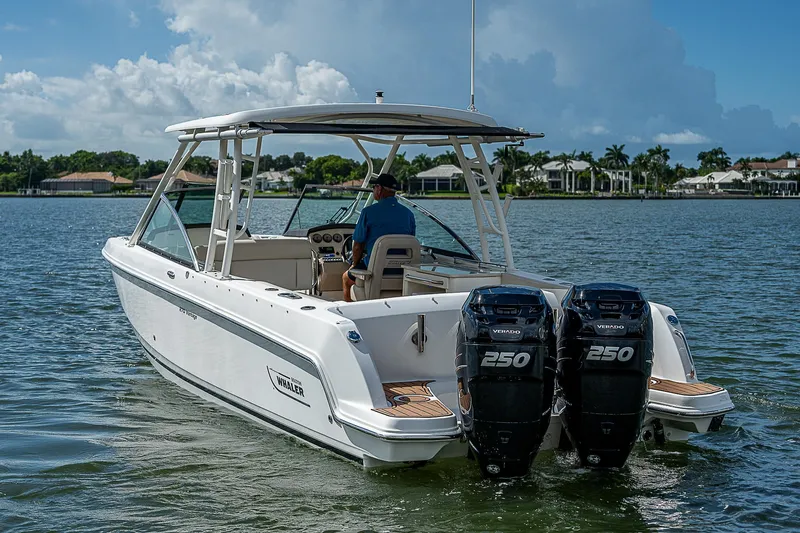  Yacht Photos Pics 2018 Boston Whaler 270 Vantage boat cruising on a sunny day.