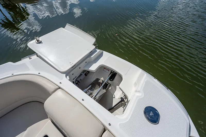 Yacht Photos Pics 2018 Boston Whaler 270 Vantage boat interior with open storage compartment.