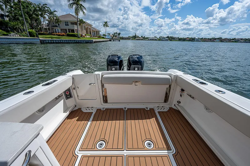  Yacht Photos Pics 2018 Boston Whaler 270 Vantage boat interior with dual engines on a sunny day.