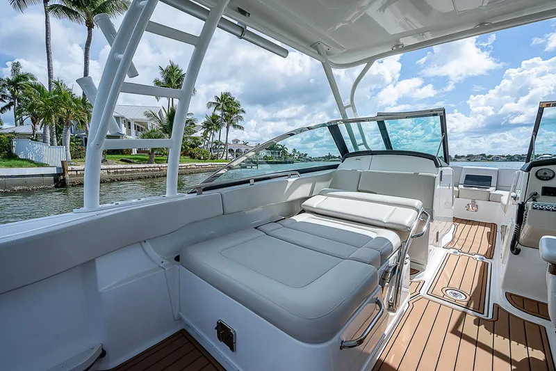  Yacht Photos Pics 2018 Boston Whaler 270 Vantage boat interior with luxurious seating and scenic waterfront view.