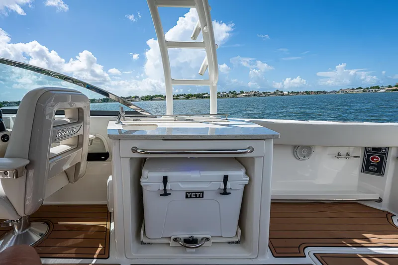  Yacht Photos Pics 2018 Boston Whaler 270 Vantage boat interior with Yeti cooler and scenic water view.