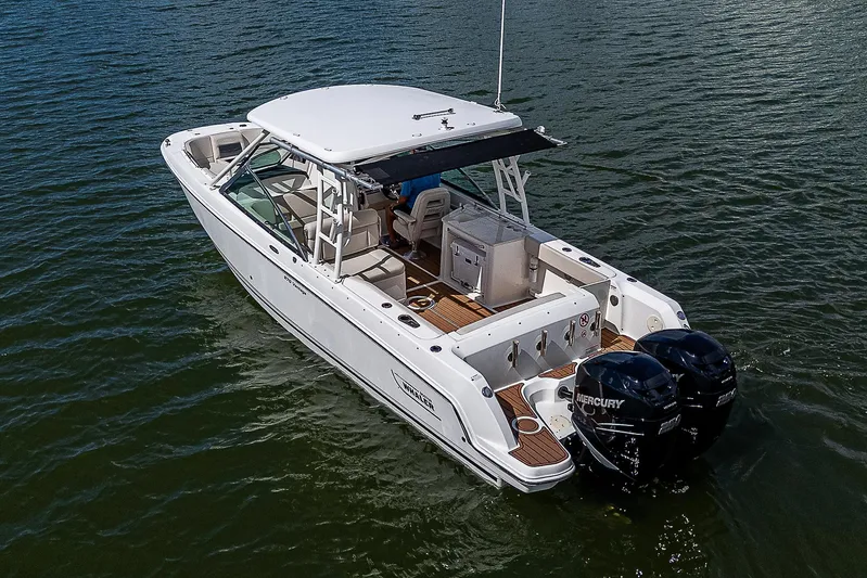  Yacht Photos Pics 2018 Boston Whaler 270 Vantage boat on water with twin Mercury engines.