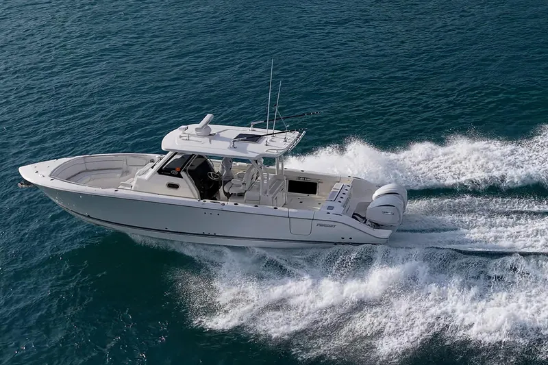 Pigasus Yacht Photos Pics 2024 Pursuit S 328 Sport boat cruising on open water.