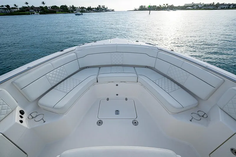Pigasus Yacht Photos Pics Luxurious seating on 2024 Pursuit S 328 Sport boat, overlooking serene waters.
