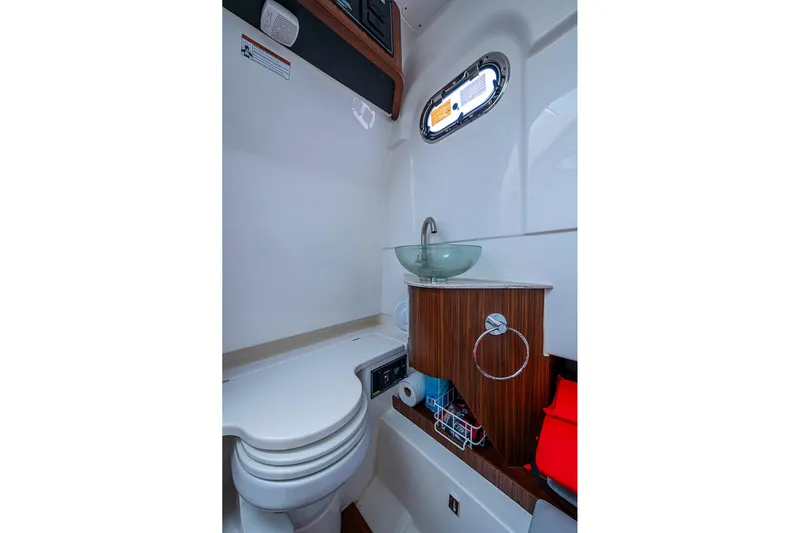 Pigasus Yacht Photos Pics 2024 Pursuit S 328 Sport boat bathroom with modern sink and compact design.
