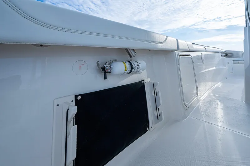 Pigasus Yacht Photos Pics 2024 Pursuit S 328 Sport boat interior with safety equipment and storage compartments.