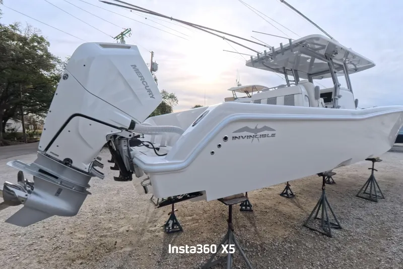 Foolish Pleasure Yacht Photos Pics 2025 Invincible 39 Open Fisherman boat with Mercury engine on stands.