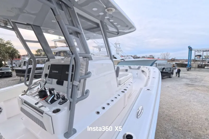 Foolish Pleasure Yacht Photos Pics 2025 Invincible 39 Open Fisherman boat with advanced Garmin navigation system.