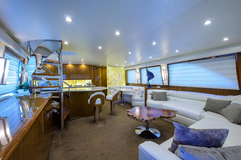  Yacht Photos Pics Luxurious interior of 2007 Viking Enclosed Bridge yacht with modern furnishings and ambient lighting.