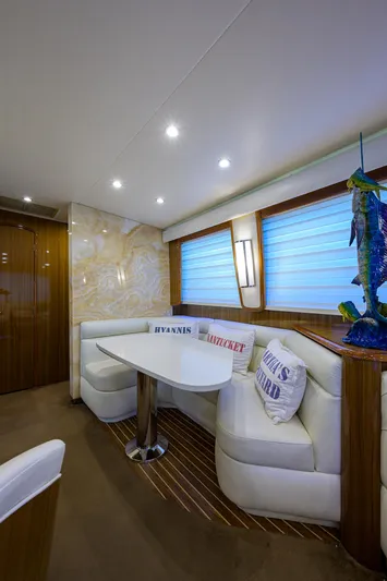  Yacht Photos Pics Luxurious 2007 Viking Enclosed Bridge yacht interior with elegant seating and decor.