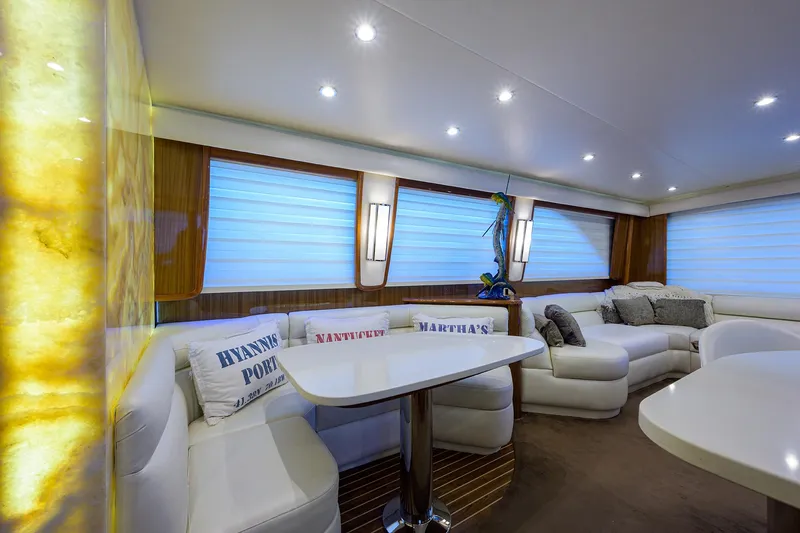  Yacht Photos Pics Luxurious 2007 Viking Enclosed Bridge yacht interior with plush seating and elegant lighting.
