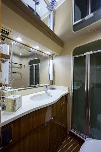  Yacht Photos Pics Luxurious bathroom in 2007 Viking Enclosed Bridge yacht with modern fixtures and elegant design.