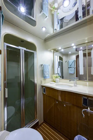  Yacht Photos Pics Luxurious bathroom in 2007 Viking Enclosed Bridge yacht with modern fixtures and elegant design.