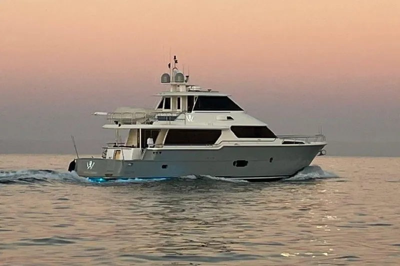 3w Yacht Photos Pics Luxurious 2010 Horizon 74 Motoryacht cruising at sunset on calm waters.