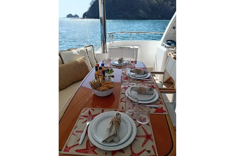 3w Yacht Photos Pics Elegant dining setup on 2010 Horizon 74 Motoryacht with ocean view.