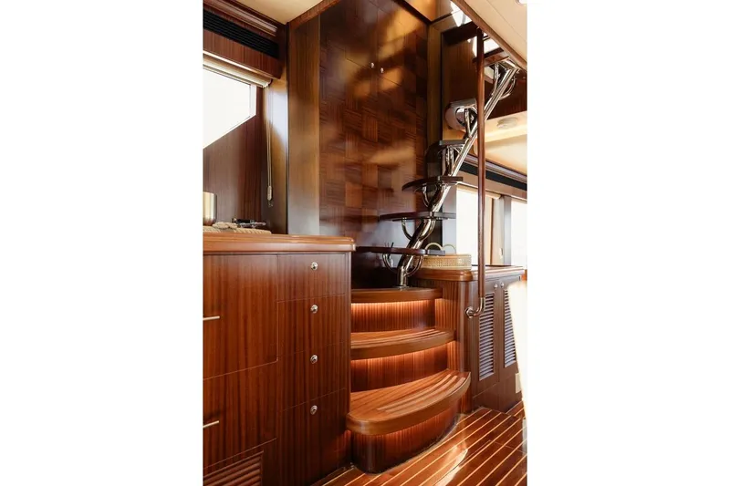 3w Yacht Photos Pics Luxurious wooden staircase interior of 2010 Horizon 74 Motoryacht, featuring elegant design and craftsmanship.