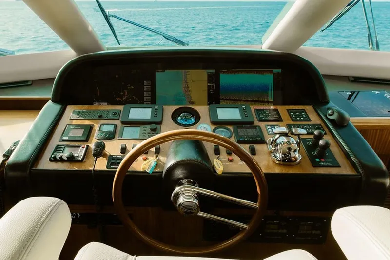 3w Yacht Photos Pics Cockpit of 2010 Horizon 74 Motoryacht with navigation instruments and ocean view.