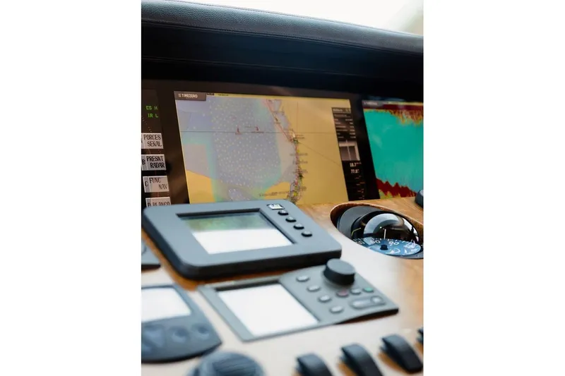 3w Yacht Photos Pics Navigation equipment on 2010 Horizon 74 Motoryacht dashboard, featuring radar and control panels.