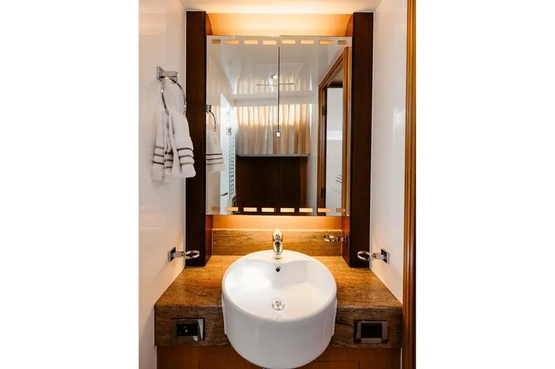 3w Yacht Photos Pics Luxurious bathroom vanity on 2010 Horizon 74 Motoryacht with modern sink and mirror.