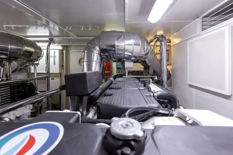 3w Yacht Photos Pics Engine room of 2010 Horizon 74 Motoryacht with polished metal components and ventilation system.