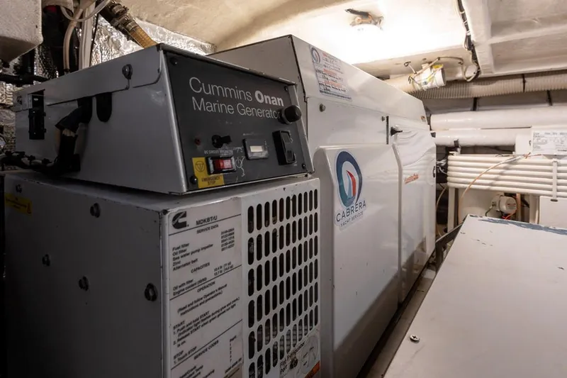 3w Yacht Photos Pics Cummins Onan marine generator in 2010 Horizon 74 Motoryacht engine room.