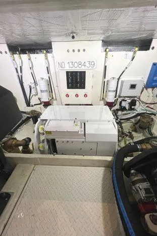  Yacht Photos Pics Engine room of 2020 Tiara Yachts 53 Coupe, showcasing mechanical components and wiring.