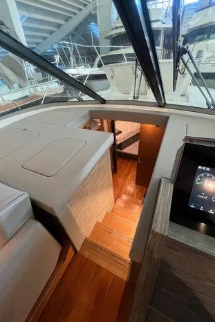  Yacht Photos Pics 2020 Tiara Yachts 53 Coupe interior with wooden stairs and modern design.