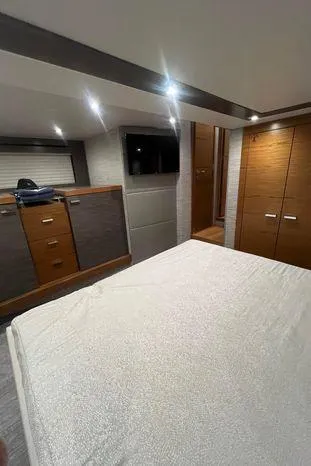  Yacht Photos Pics Interior of 2020 Tiara Yachts 53 Coupe, featuring modern bedroom design.