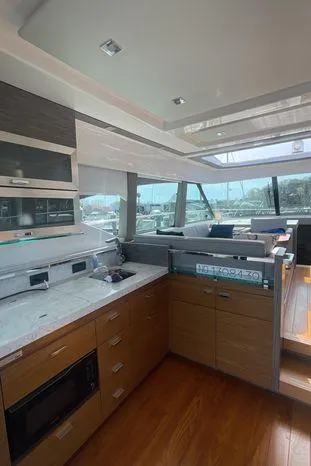  Yacht Photos Pics Interior of 2020 Tiara Yachts 53 Coupe with modern kitchen and seating area.