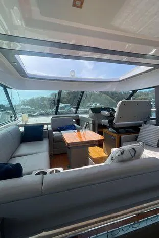  Yacht Photos Pics Interior of 2020 Tiara Yachts 53 Coupe with spacious seating and panoramic windows.