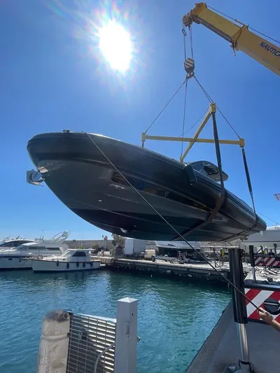  Yacht Photos Pics SACS Rebel 47 yacht being lifted by crane at marina, sunny day, 2018 model.