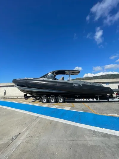 Yacht Photos Pics 2018 SACS Rebel 47 boat on trailer under clear blue sky.