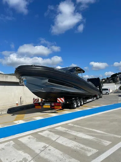  Yacht Photos Pics 2018 SACS Rebel 47 boat on trailer under blue sky at marina.