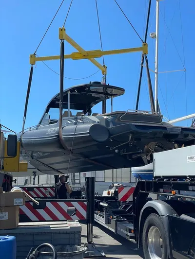  Yacht Photos Pics 2018 SACS Rebel 47 boat being lifted by crane in a shipyard.
