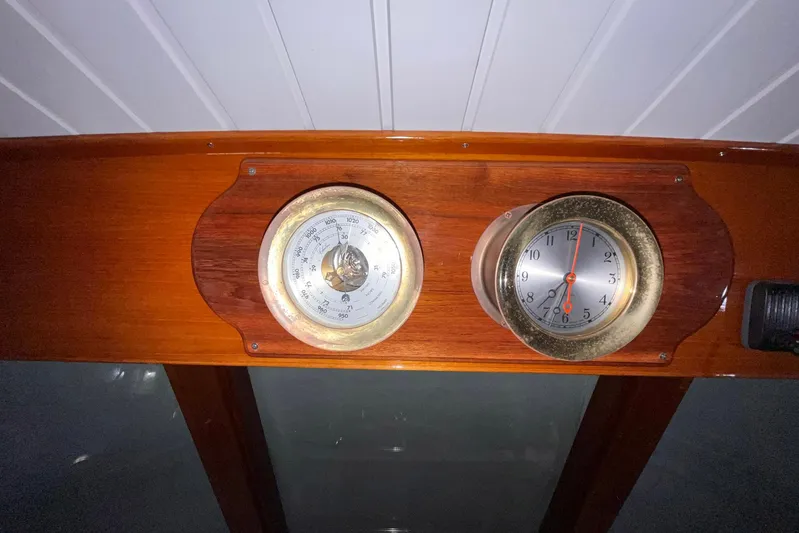 Last Dance Yacht Photos Pics Wooden dashboard with barometer and clock on 2001 Grand Banks 49 Eastbay HX yacht.