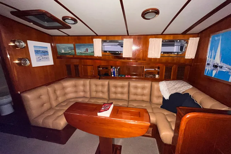 Last Dance Yacht Photos Pics Luxurious interior of 2001 Grand Banks 49 Eastbay HX yacht with plush seating and nautical decor.