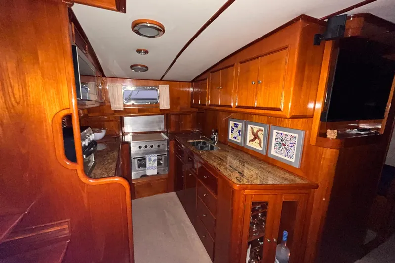 Last Dance Yacht Photos Pics Luxurious wooden interior of 2001 Grand Banks 49 Eastbay HX yacht kitchen.