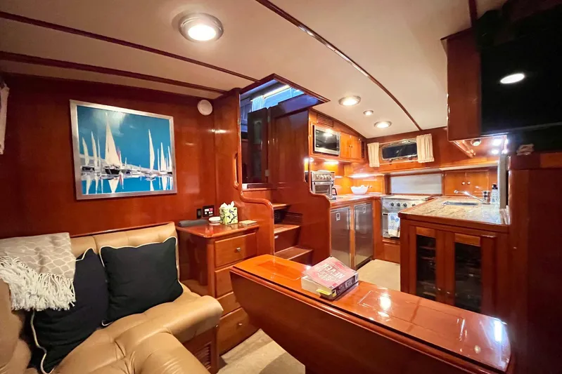 Last Dance Yacht Photos Pics Luxurious 2001 Grand Banks 49 Eastbay HX yacht interior with elegant wood finishes.