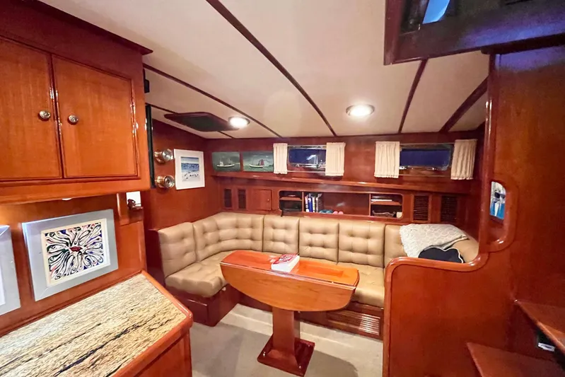 Last Dance Yacht Photos Pics Luxurious 2001 Grand Banks 49 Eastbay HX yacht interior with plush seating and elegant wood finishes.