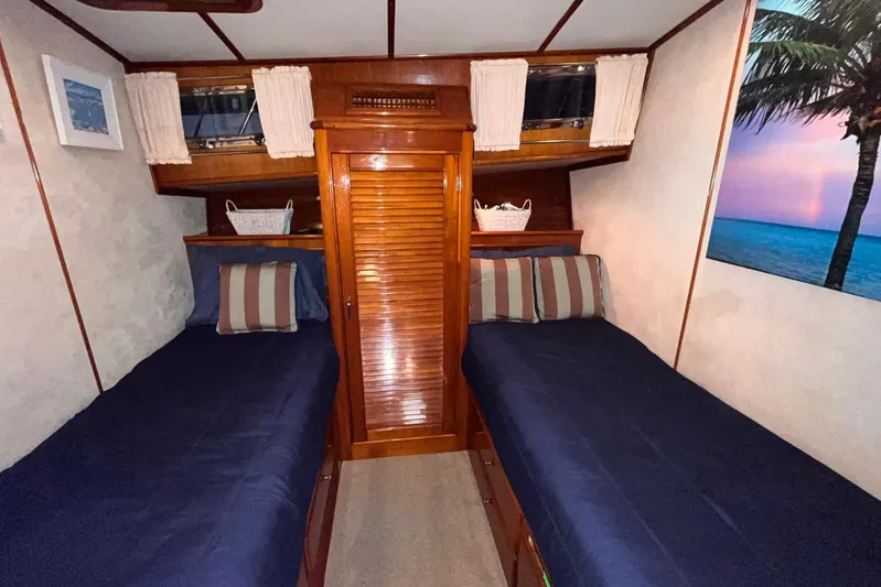 Last Dance Yacht Photos Pics Cabin interior of 2001 Grand Banks 49 Eastbay HX with twin beds and nautical decor.