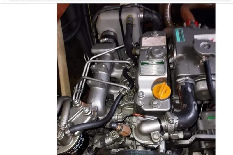 Yolo Yacht Photos Pics Engine of a 2006 Lagoon 410-S2 catamaran, showcasing intricate mechanical components.