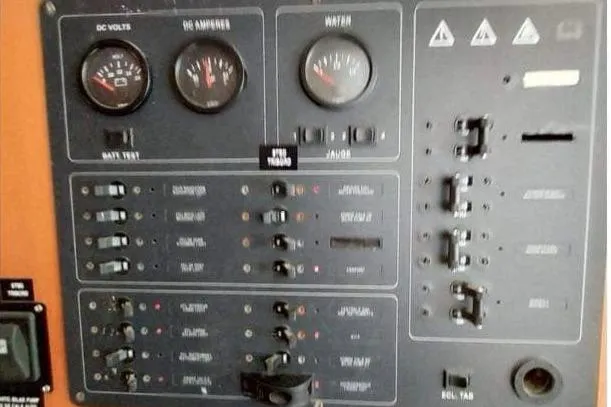 Yolo Yacht Photos Pics Control panel of a 2006 Lagoon 410-S2 catamaran with gauges and switches.