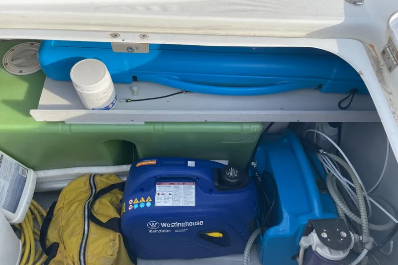 Yolo Yacht Photos Pics Storage compartment of a 2006 Lagoon 410-S2 with Westinghouse generator and supplies.