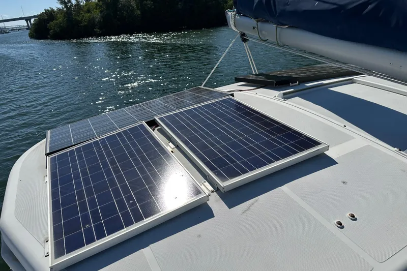 Yolo Yacht Photos Pics Solar panels on a 2006 Lagoon 410-S2 catamaran, harnessing energy on a sunny day.