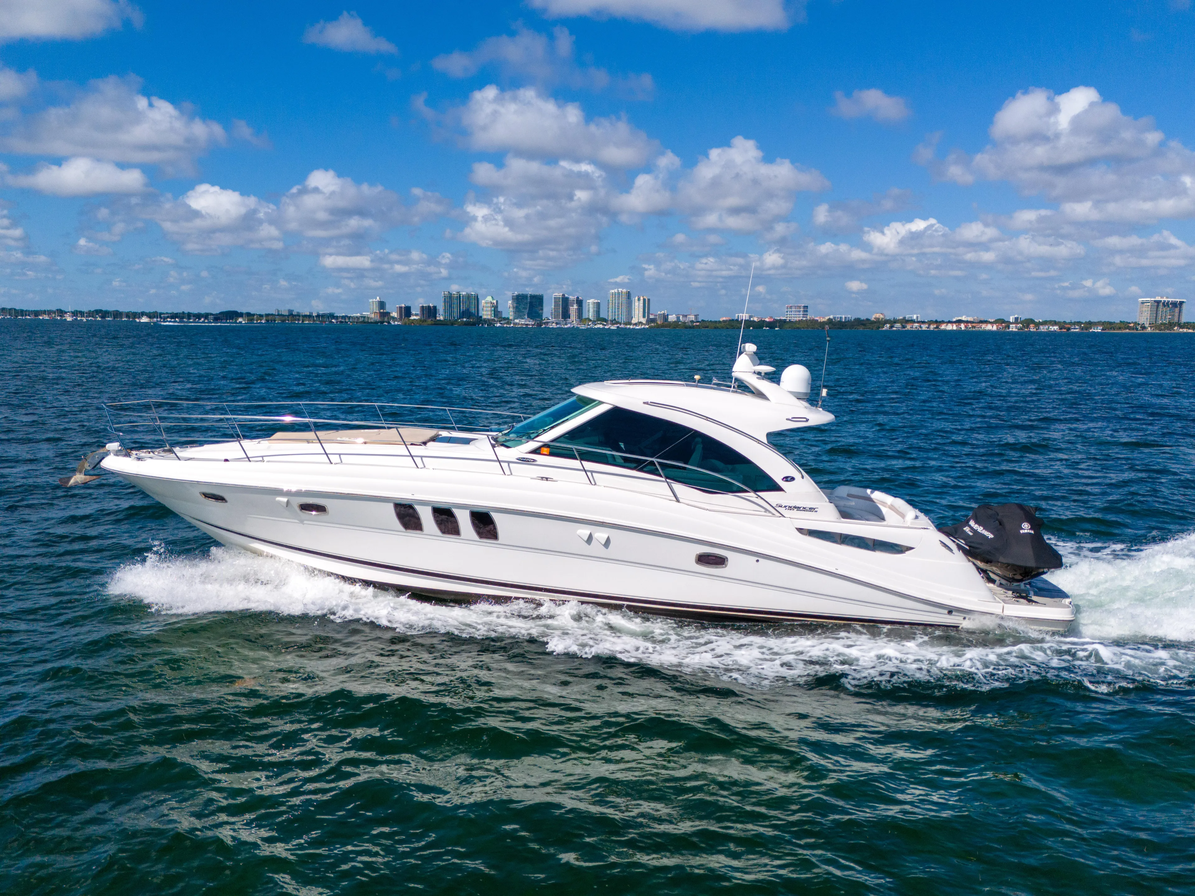  Yacht Photos Pics 2010 Sea Ray 500 Sundancer cruising on open water under a clear blue sky.