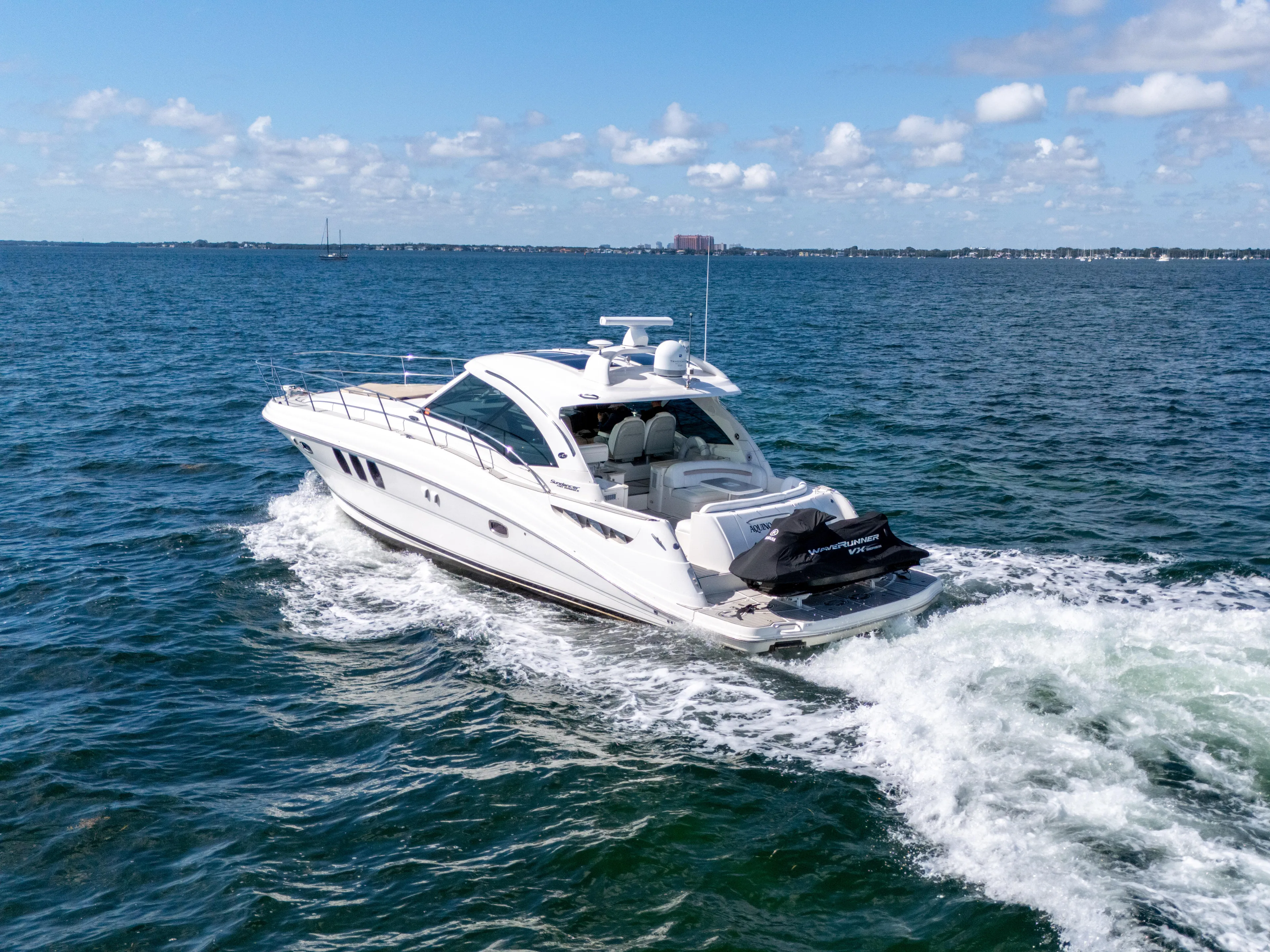  Yacht Photos Pics 2010 Sea Ray 500 Sundancer cruising on open water under a clear blue sky.