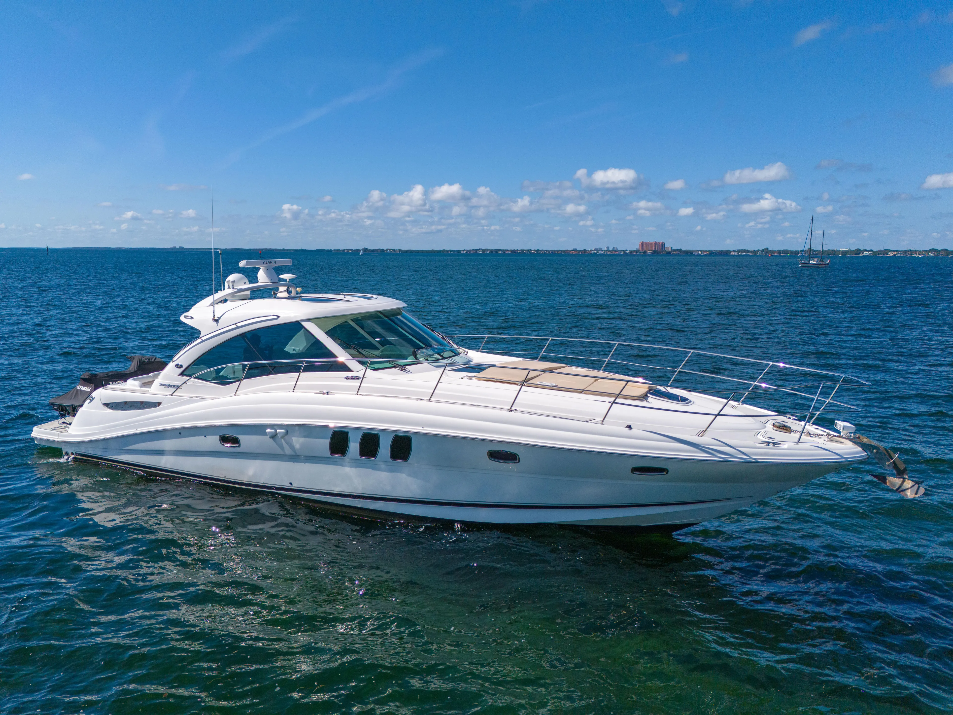  Yacht Photos Pics 2010 Sea Ray 500 Sundancer yacht cruising on open water under a clear blue sky.